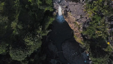 Amazing waterfall in between the green forest aerial footage top down view Stock Footage 100654749