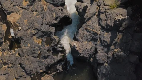 Amazing waterfall between the rocks top down view aerial footage Stock Footage 100654561