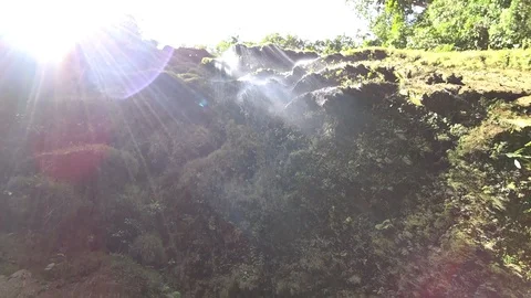 Amazing waterfall with a glitter of the sun by action cam Stock Footage 127841153
