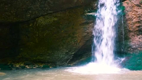 Amazing waterfall in a mountain gorge, falling water hitting water surface, some Video stock 201180483