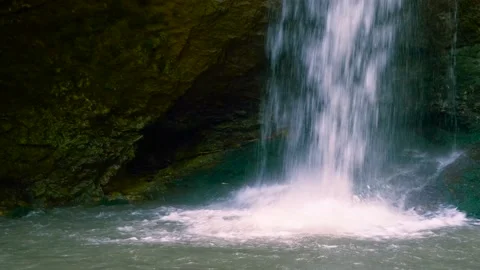 Amazing waterfall in a mountain gorge, falling water hitting water surface, some Stock Footage 201180664