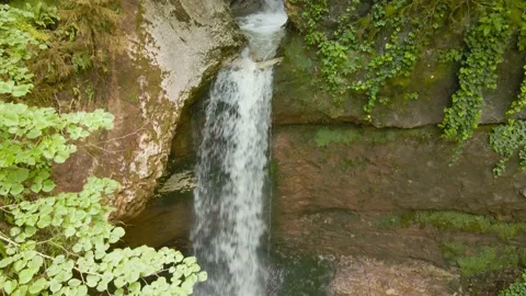 Amazing waterfall in a mountain gorge, falling water hitting water surface, some Stock Footage 201180780