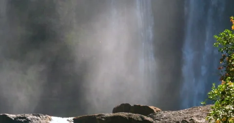 Amazing Waterfalls Cascading Down In Backlite Sun On Mist Rising Back Up Stock Footage 138339728