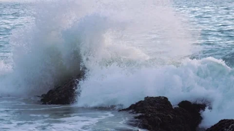 Amazing waves wash over sandy Laguna Beach under a clear sky in 4k Stock Footage 281323006