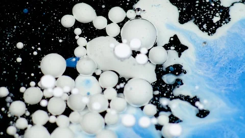 Amazing white and blue bubbles of paint on the oil surface. Paint in oil. Stock Footage 105186735