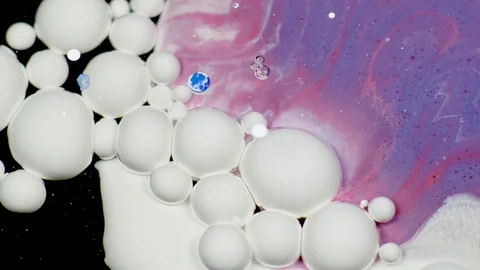 Amazing white bubbles of paint on the purple oil surface. Paint in oil. Stock Footage 105190126