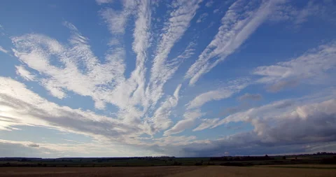 Amazing white clouds over the field. Timelabs Stock Footage 210881342