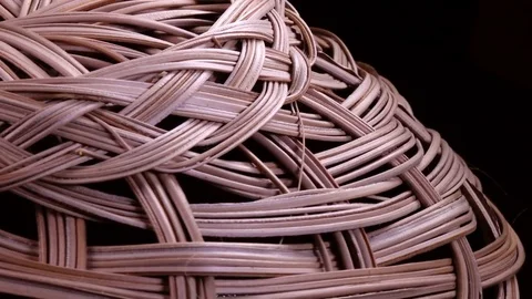 Amazing wicker vase upside down close up, rotating on black background Stock Footage 84111713