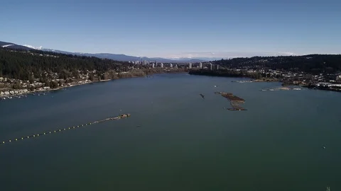 Amazing Wide Angle Flyover Lake Harbor By Beautiful Skyline With Mountains Video stock 104587484