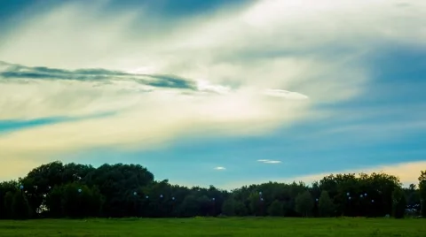 Amazingly beautiful sky with clouds and sun, green grass and the people Stock Footage 66189360