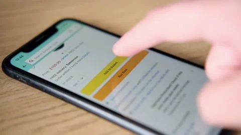 Amazon add to basket on iPhone Stock Footage 140192279
