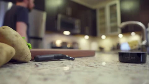 Amazon Alexa device in kitchen with home chef Stock Footage 131571001