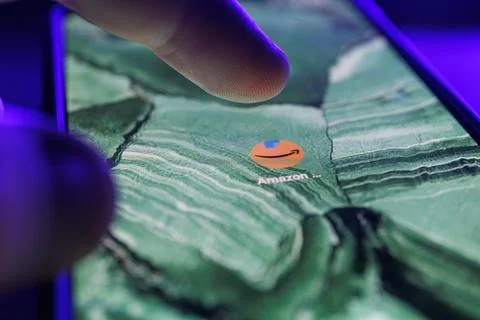 Amazon app on smartphone screen. Close up shot of Amazon app Stock Photos