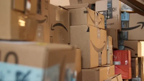 Amazon boxes being stacked in a warehouse Stock Footage 148800036