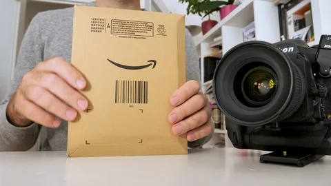 Amazon Cardboard envelope with Pantone X Rite ColorChecker Stock Footage 117851530