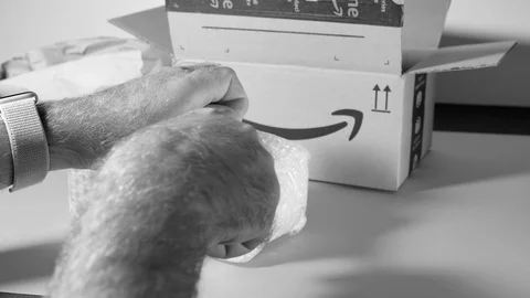 Amazon Cardboard parcel box containing packaging paper and bubble wrapped box Video stock 117852198