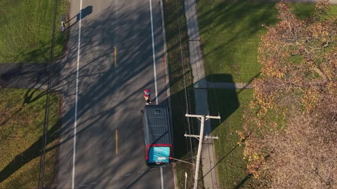 Amazon delivery driver carrying a package Stock Footage 340270093
