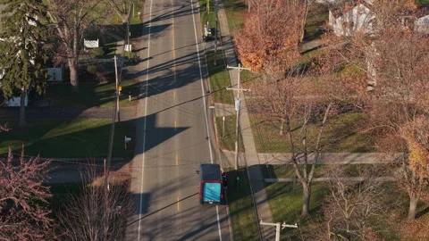 Amazon Delivery Driver Returning to Van, Aerial View Stock Footage 340269977