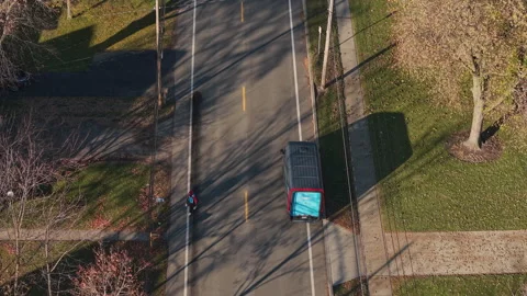 Amazon Delivery Driver Returning to Van, Aerial View Stock Footage 340270180