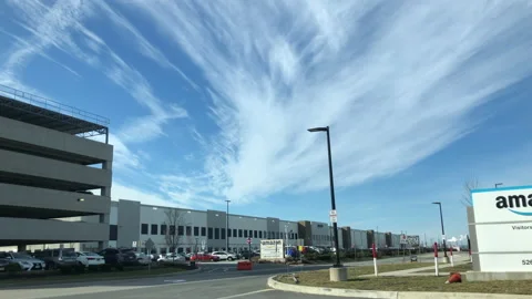 Amazon Distribution Center Exterior. Wide angle Drive By Stock Footage 231589055