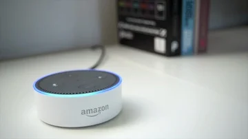 Amazon Dot Activating with Books In The Background Stock Footage 86153357