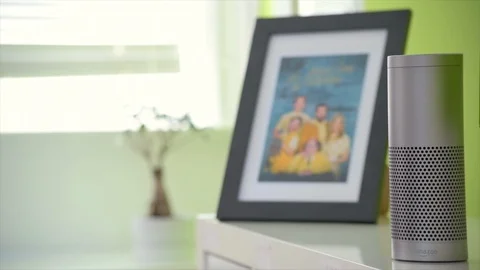 Amazon Echo Activates It's Light in Family Home Stock Footage 90766430