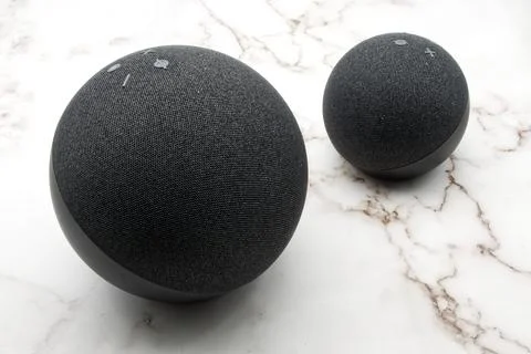 Amazon Echo and Echo Dot. Alexa, virtual assistant AI. Marble background Stock Photos