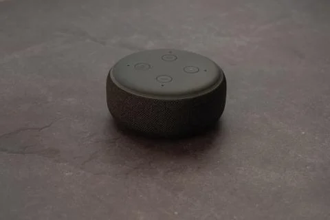 Amazon Echo Dot and Alexa with a modern stone background. Stock Photos