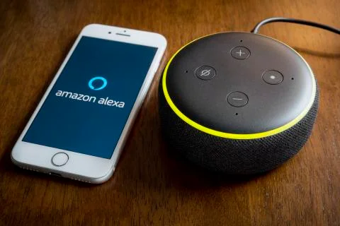 Amazon Echo Dot and Smartphone Stock Photos