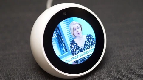 Amazon Echo Dot Showing the TV News on its Screen Video stock 100607396