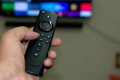 Amazon fire stick TV remote in hand Stock Photos