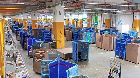 Amazon fulfillment center interior with package sorting system Stock Footage 333487848
