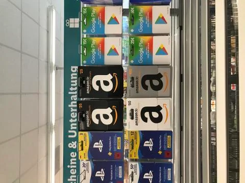 Amazon Gift Cards, Google Pay gift cards on store shelves Stock Photos