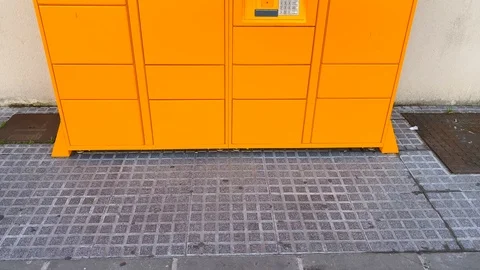 Amazon hub Locker pick up point in Spain, tilting up 4K Video stock 122948387