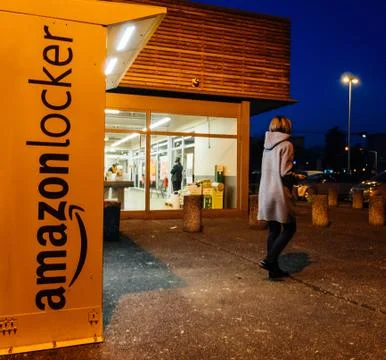Amazon Locker with customer leaving after pick-up parcel Stock Photos