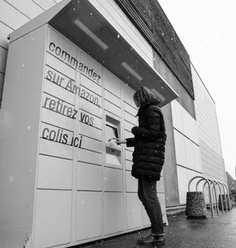 Amazon Locker the self-service parcel delivery service woman Stock Photos