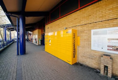 Amazon Locker yellow parcel delivery machine at train statiaon in UK Stock Photos