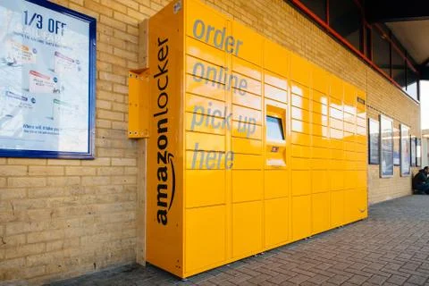 Amazon Locker yellow parcel delivery machine at train statiaon in UK Stock Photos