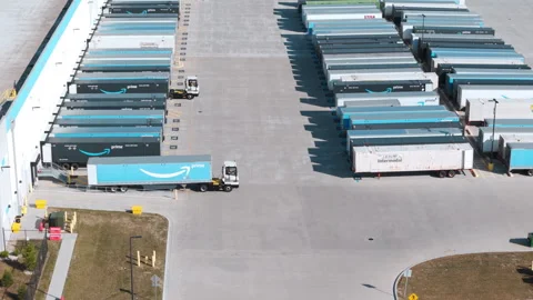 Amazon logistic yard with many parked trailers and trailers rearrangements Stock Footage 318995110