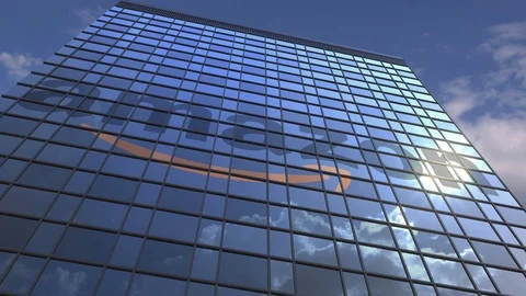 AMAZON logo against modern building reflecting sky and clouds, editorial Vídeos de archivo 109438441