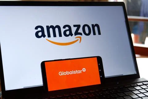 Amazon logo on a laptop screen and Globalstar logo on a smartphone, symboli.. Stock Photos
