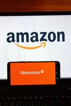 Amazon logo on a laptop screen and Globalstar logo on a smartphone, symboli.. Stock Photos