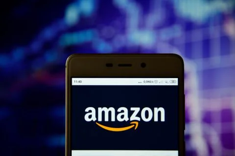 Amazon logo is seen on an smartphone Stock Photos