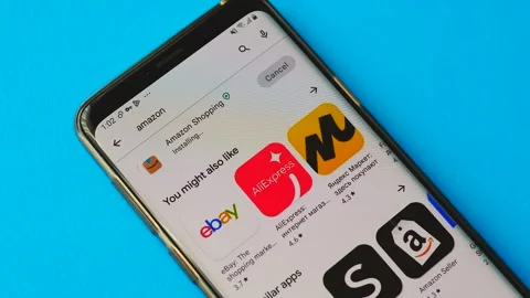 Amazon mobile application is installed on a smartphone, close-up. Amazon online Stock Footage 208898760