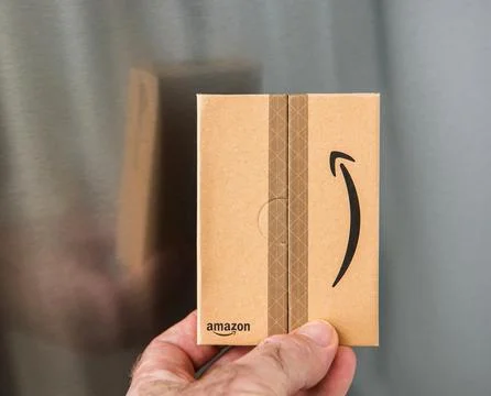 Amazon Package Held by Hand Stock Photos