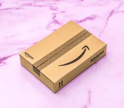 Amazon Package on Pink Surface Stock Photos