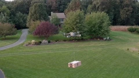 Amazon packages home delivery by Air Drone service. Doorstep to house. Stock Footage 163965373