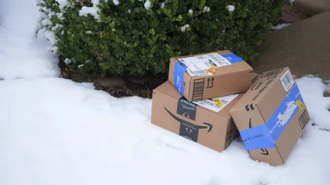 Amazon parcel delivery to your doorstep in winter. Naperville IL USA 14 Dec 2024 動画素材 296087210