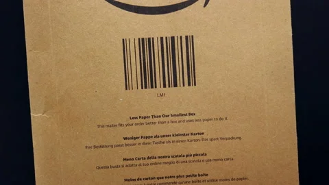 AMAZON parcel with paper saving information for an environmental concept Video stock 171643174