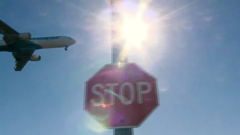 Amazon Prime Air plane flies above STOP sign Stock Footage 102572255